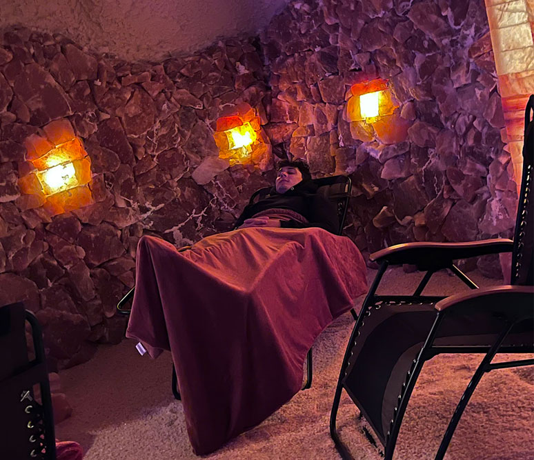 young man relaxing in the salt cave